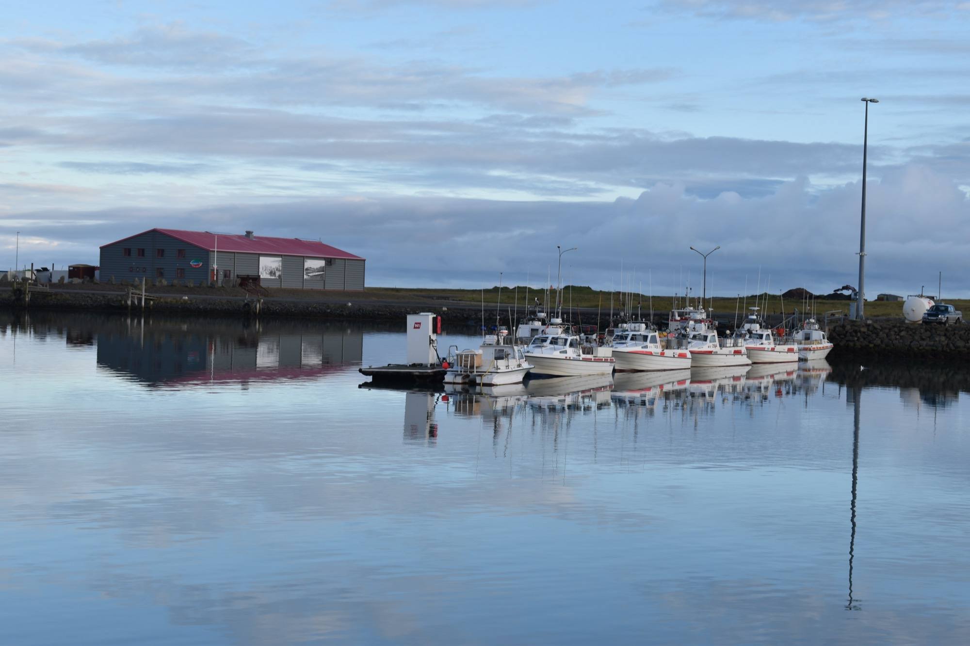 Small fishing boats reflected in Höfn harbour